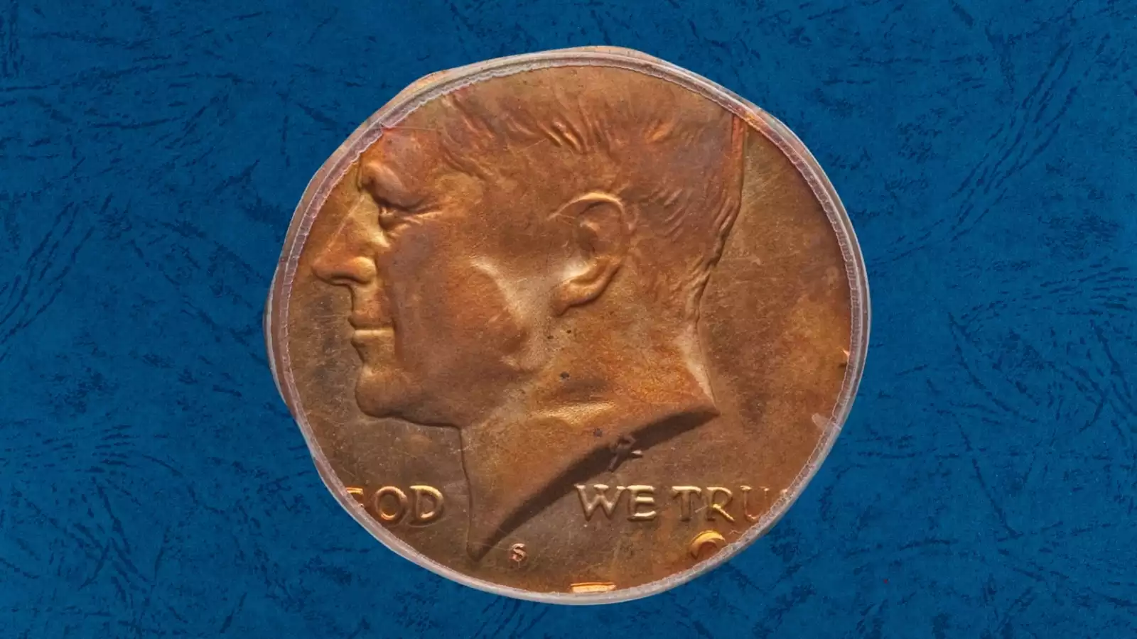 1972 Kennedy half dollar struck on nickel planchet showing smaller coin with missing outer design elements beside normal half dollar for size comparison